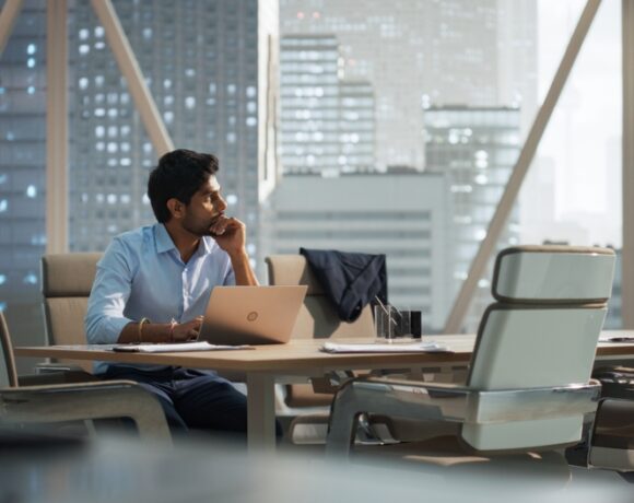 Portrait,Of,A,Young,Indian,Account,Manager,Working,On, saaz digital